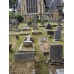 Tombstone, cemetery in London, solar cross, solar disc